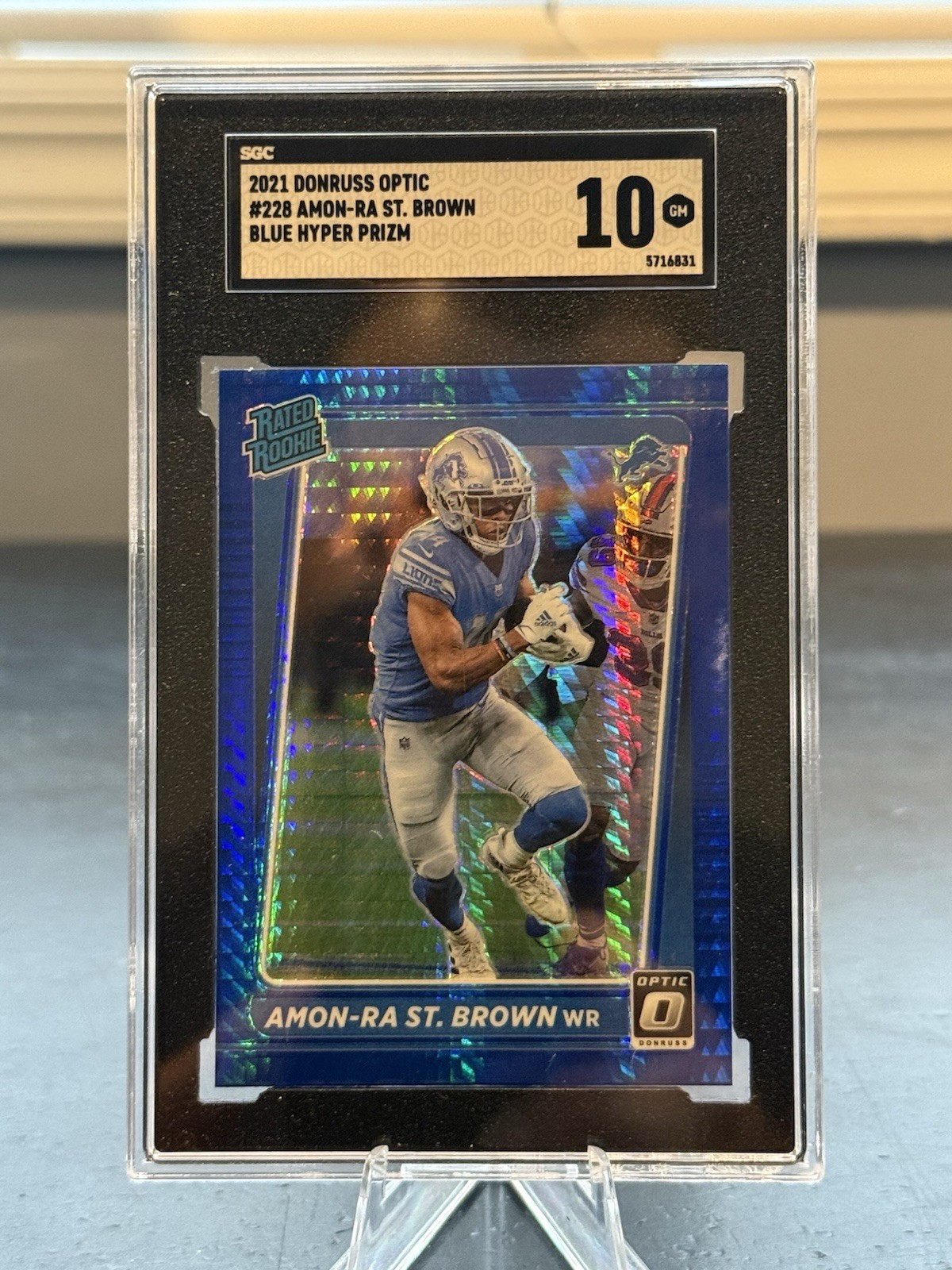 2021 DONRUSS OPTIC #228 AMON-RA ST. BROWN BLUE HYPER RATED ROOKIE SGC 10 Lions