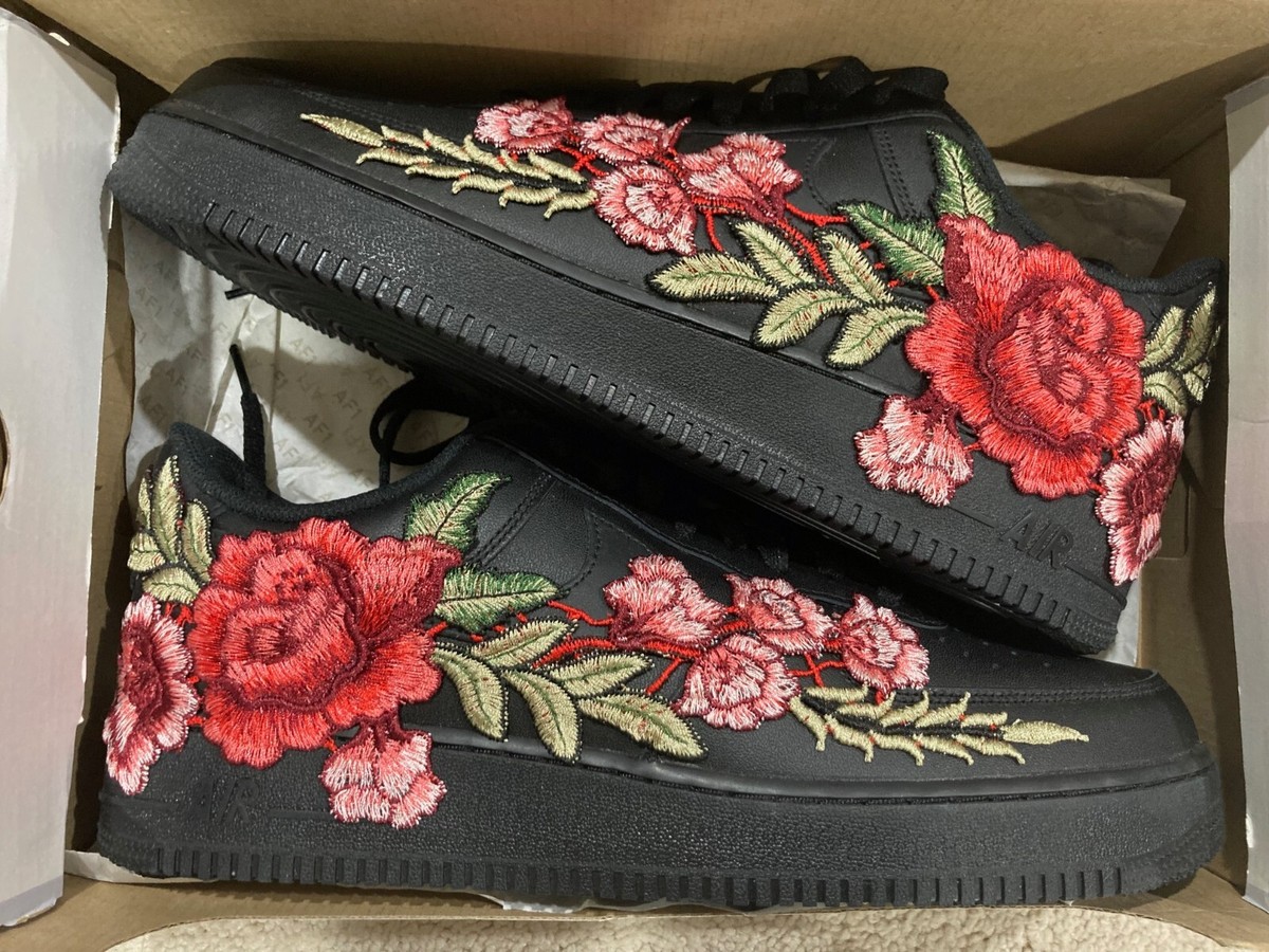 black nikes with flowers