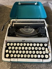 Smith Corona Cougar Deluxe Manual Turquoise Typewriter with Hard Case Pre-Owned thumbnail