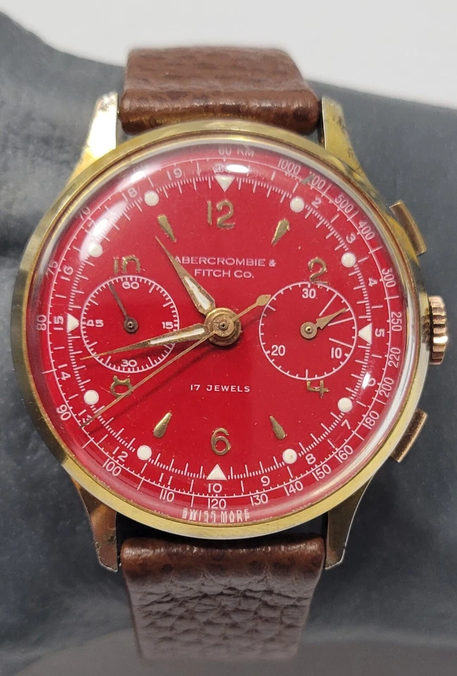 Reloj manual suizo raro Abercrombie & Fitch Two Register esfera roja 17 Jwls para hombre