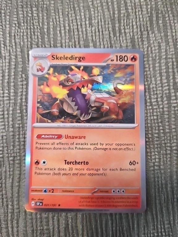 031/191 Skeledirge : Holo Rare Card - Surging Sparks - Pokemon TCG - NM