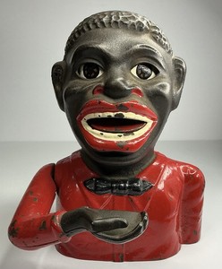 EARLY 1900S CAST-IRON MECHANICAL BANK REFLECTING PERIOD RACIAL CARICATURES