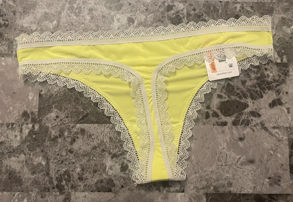 BRAGAS TANGA FINAS CALVIN KLEIN PEQUEÑAS LISAS AMARILLAS ENCAJE NUEVAS CON ETIQUETAS Foto 3 de 4
