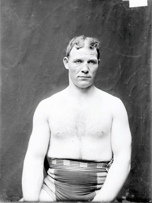 Jack Monroe Boxer Sitting Facing The Camera In A Stairwell Hallwa - Old Photo