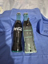 Vintage Coca-Cola handles for cooler doors and a Starr X cast  bottle  opener