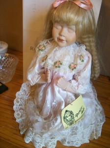 praying porcelain doll