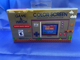 Nintendo Game and Watch Super Mario Bros Electronic Handheld In Hand.
