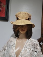 The J. Peterman Straw Hat Woven Raffia Bucket Style Braided Band Button Accent.