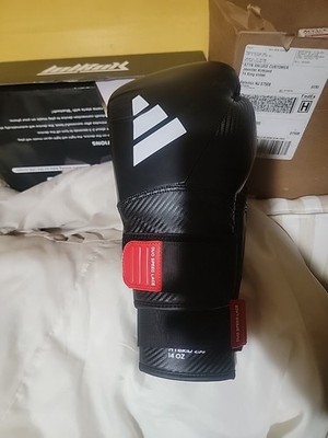 This is a pair of black and white Adidas Hybrid 250 Duo Lace boxing gloves