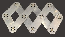 Joli dessous de plat accordéon en inox et laiton vintage 1970-80