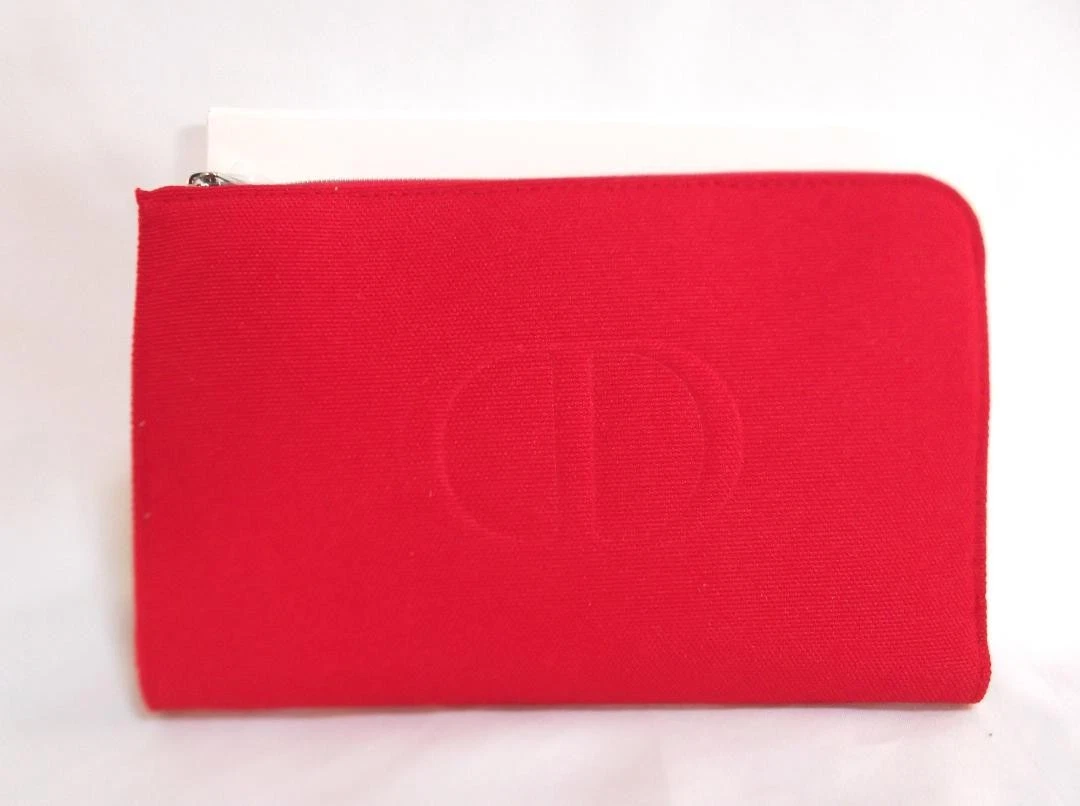 Pochette Christian Dior nouveauté fermeture éclair ronde neuve jamais utilisée JP
