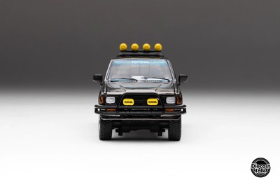 1/64 Toyota 1985 Hilux SR5 4x4 Black Chrome Pink Skate DiecastTalk