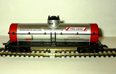 HO SCALE OPERATION LIFE SAVER TANK CAR WHEN IT'S A TIE AT A CROSSING YOU LOSE 