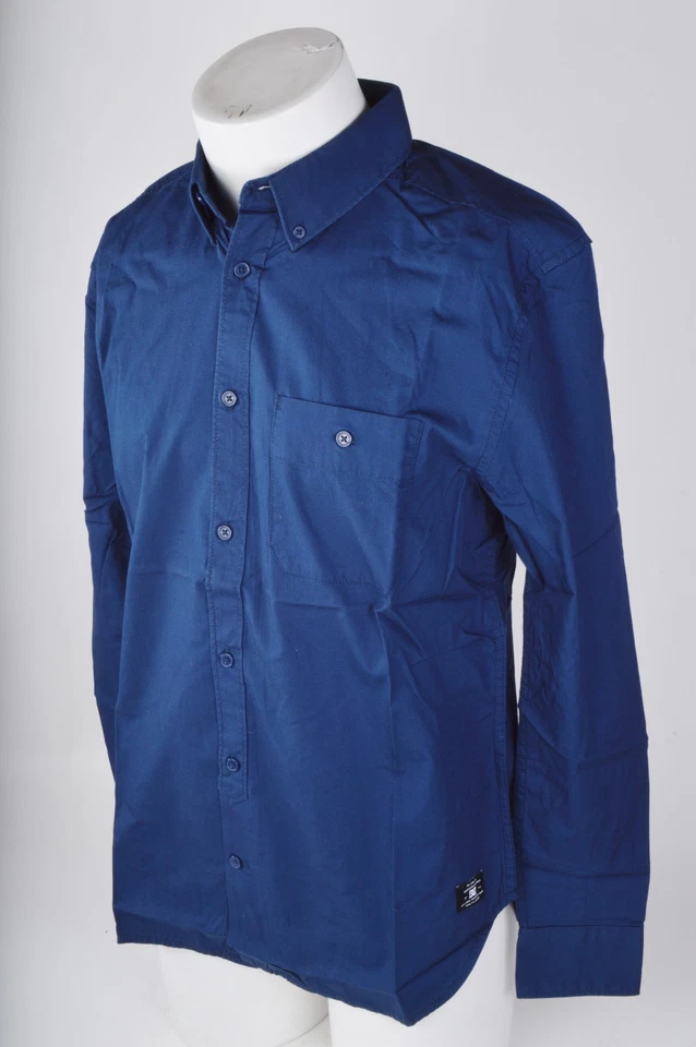  CAMISA MANGA LARGA DC MELWOOD DC NUEVA CON ETIQUETAS PARA HOMBRE $50 M azul universitario ls abotonada Foto 2 de 4