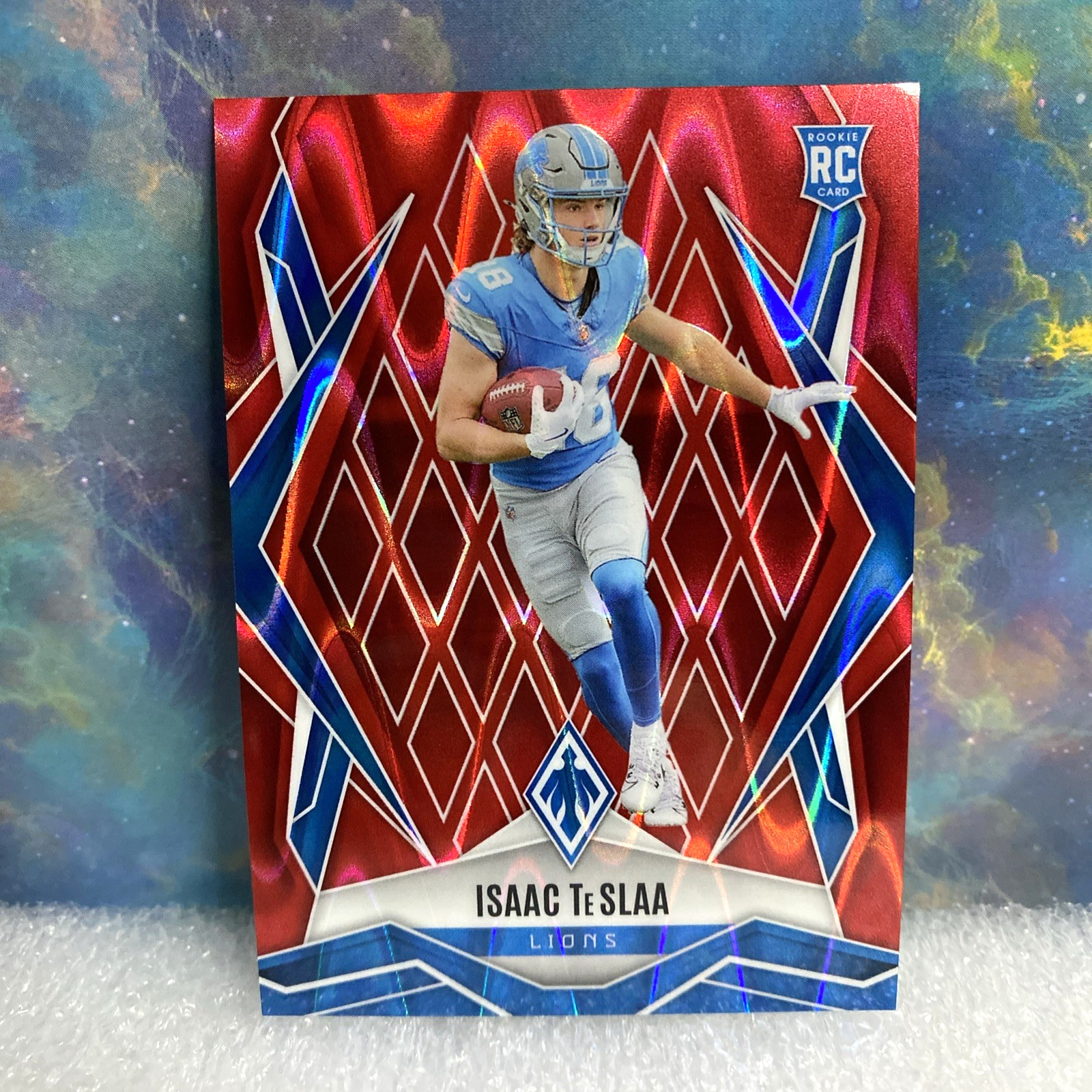 2025 Panini Phoenix  Rookies Isaac Teslaa #189 Red /99 RC Detroit Lions