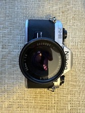 Nikon FG-20 35mm Film SLR camera with Nikon 50mm lens, 70-210 Sigma, Flash