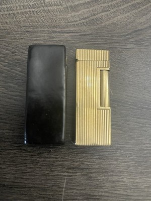 Vintage 14kt gold jacketed Dunhill Rollagas lighter with textured wheel.