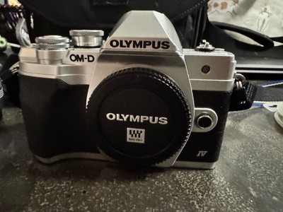 olympus om-d e-m10 mark iv with 2 lenses, carry case, 2 filters