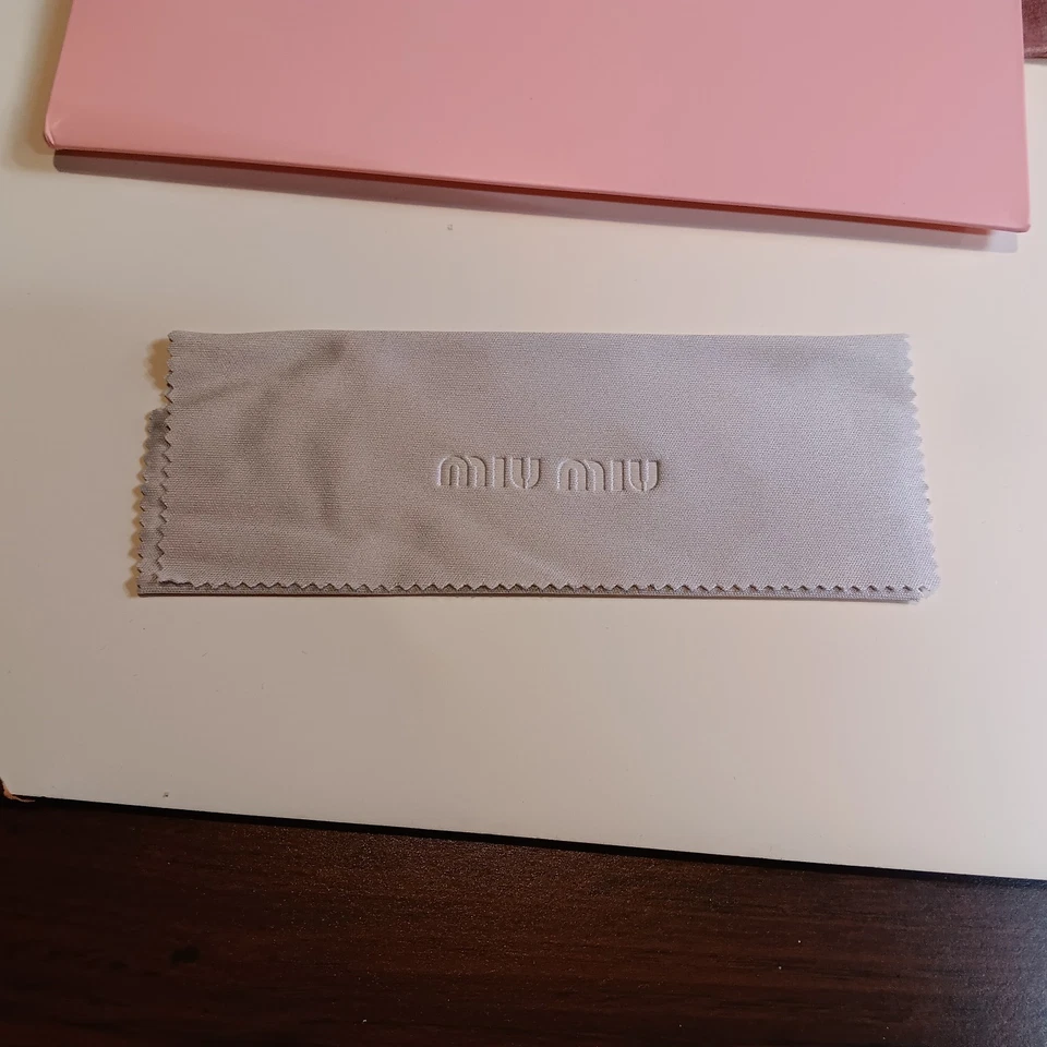 Gafas de sol para mujer Miu Miu Mu A51S marco dorado marrón sin montura Foto 3 de 4