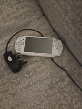 Sony PSP White Handheld System with PSP Memory Card game and charger.