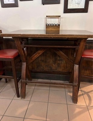 handcrafted wooden high top table with 4 cushioned bar stool made by a local man