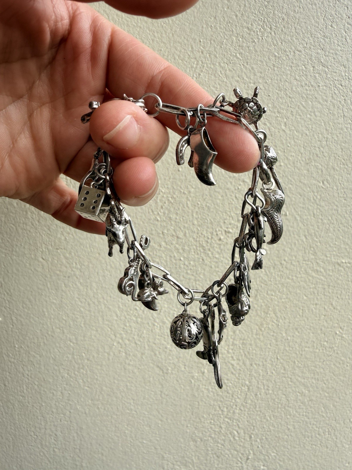 A vintage-style silver charm bracelet