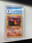 Pokemon Charmander Team Rocket 1st Edition 50/82 CGC 8 NM/Mint