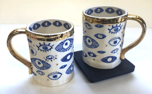 Anthropologie Insight Set of 2 Mugs Hamsa Blue Evil Eyes Stoneware Gold Trim