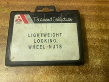 COMPLETE SET  OF GENUINE MITSUBISHI  LOCKING  ALLOY WHEEL  NUTS    L200 K74