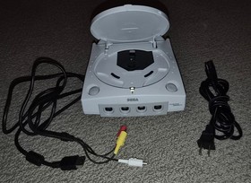 Sega Dreamcast console and cords in good condition