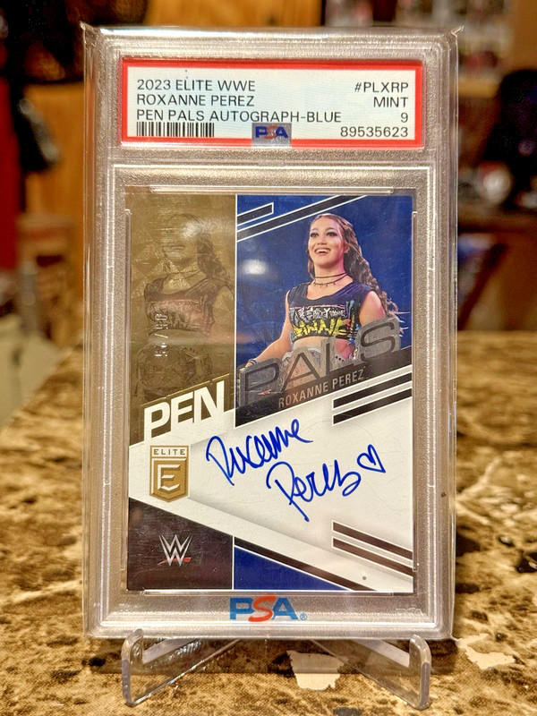2023 Panini Donruss Elite WWE Roxanne Perez /25 Pen Pals Blue On Card Auto PSA 9