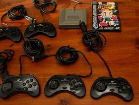 6x mk2 official Sega Saturn controllers, Saturn Bomberman game, & multi-tap