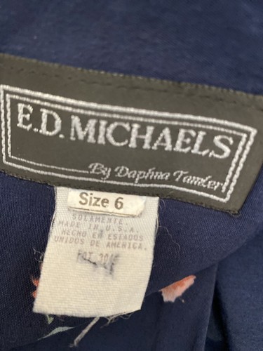 Vintage E.D. Michaels midi dress in navy blue with white label showing size 6, floral accents, and “Made in U.S.A.” text.