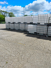 Lot of IBC Tote Liquid Storage/Shipping Containers in Metal Cages