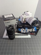 White Canon EOS Rebel SL1 w/ Extra Lense, Battery, Battery Charger  Strap