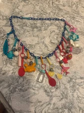 Vintage 80s Plastic Clip On Bell Charm Necklace 15 Charms With Blue Chain