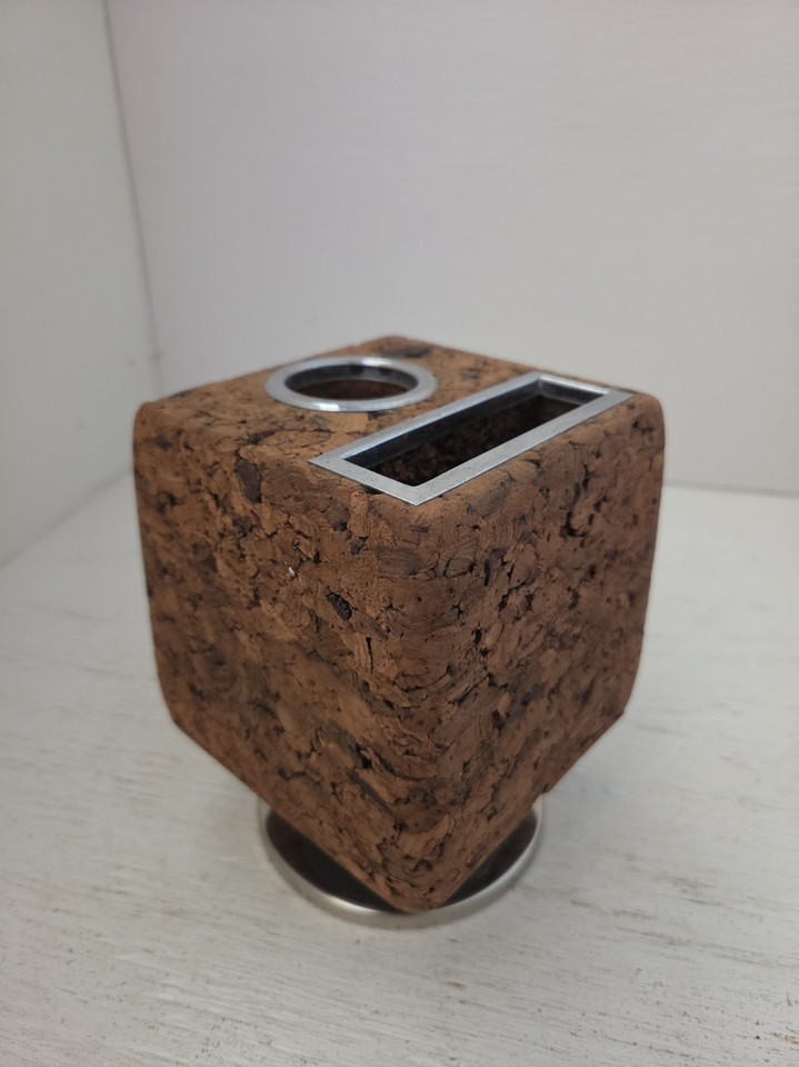 A Park Sherman spinning cork cube from the 1960s — a rotating desktop organizer that's basically kinetic sculpture for your desk.