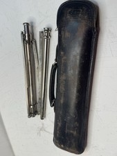 A vintage folding tripod for a camera or a music