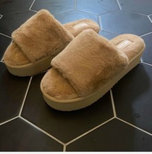 Brand new never been worn tan colored Muk Luk platform slippers