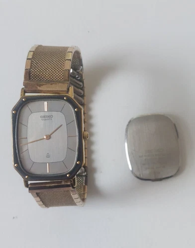 Vintage Seiko Gold Tone Black Rim Mens Quartz Rectangle 6020-4220 AS IS