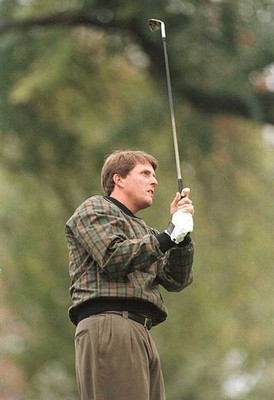 Phil Mickelson stares down the fairway as he watches for the resul- Old Photo