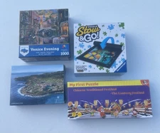 Puzzles, Three Puzzles and a Store & Go Mat.  All Items New And Sealed.