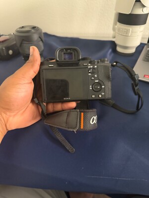 Sony A7 II (body) with 28-70mm, 50mm, and 70-200mm lenses, plus a Godox flash.