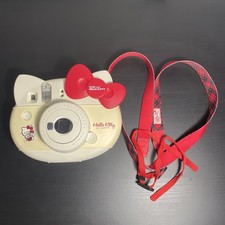 Hello Kitty Fujifilm Instax Mini fotocamera pellicola istantanea arco rosso funziona (FedEx)
