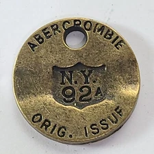 Abercrombie & Fitch 1892-1904 Vtg Brass Hang Ear Tag Jewelry Pendant Medallion