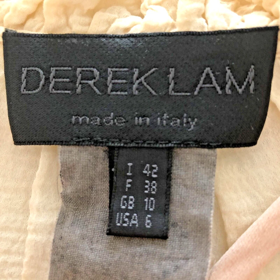 Top italiano Derek Lam de colección para mujer talla 6 marfil con volantes rosas manga larga Foto 4 de 4