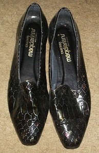 black flats with gold trim