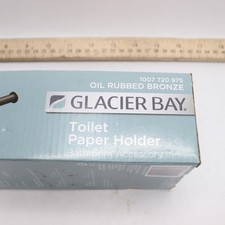 Glacier Bay Wall Mounted Sadira Toilet Paper Holder in Bronze
