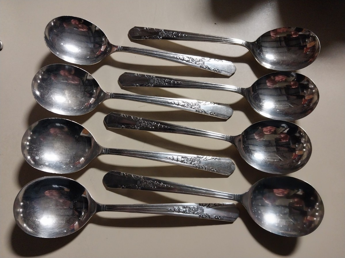 8 soup spoons simeon l. & george h. rogers company oneida ltd