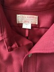 Red Filson Virgin Wool shirt, size L, with white label showing company name and “Made in USA” text.